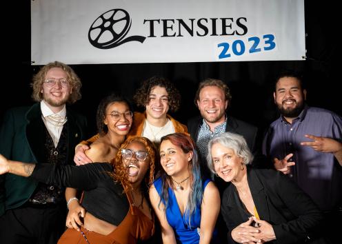 A group of students smile in front of a banner that reads: Tensies 2023
